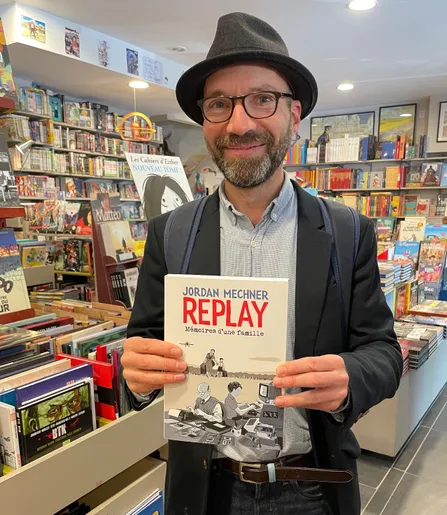 Jordan Mechner in a bookstore in Paris with his new graphic novel memoir, REPLAY.