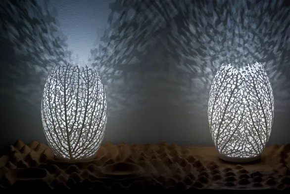 Two hyphae lamps look like leaf skeletons curled up and project intricate shadows