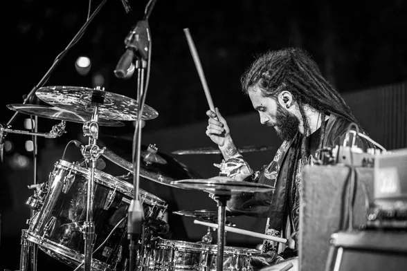 Black and white picture of me playing drums on a live show