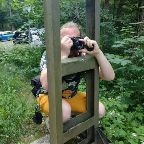 Me with a Zenit SLR, hugging a tram catenary pole