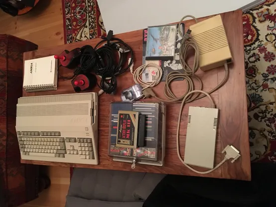 an amiga 500 with lots of accessories on a table