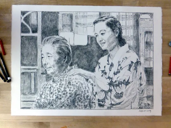 Two Japanese women, one elderly (Tomi) and one younger (Noriko), in a rather dark room with a bright square of light coming through a small window.  They both wear light-coloured yukata, Tomi's in a conservative pattern of small blossoms, Noriko's in a bold pattern of large dark thistle-like flowers. Noriko s rubbing Tomi's shoulder and smiling faintly.