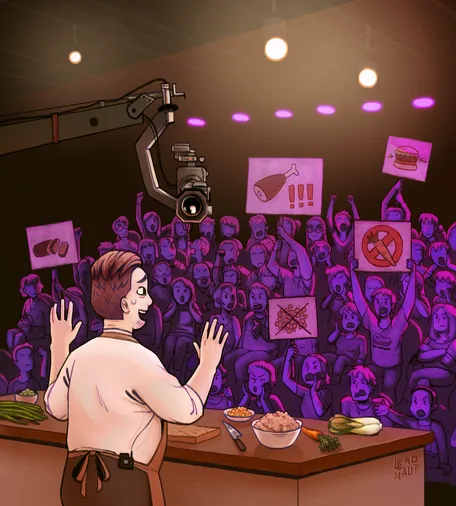 A TV studio recording a cooking show, with a clearly distressed cook standing in front of a table full of vegetarian / vegan ingredients, their hands raised placatingly. The audience in front of them is clearly outraged, waving protest signs demanding meat.