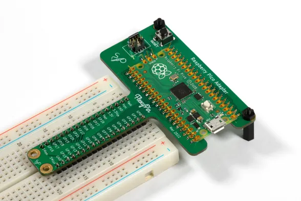 An RPi Pico attached to a t-shaped pcb using FlexyPins. The t-shaped pcb's t-leg is plugged into a breadboard.