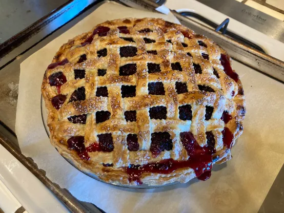 A well-baked lattice-top blackberry pie.