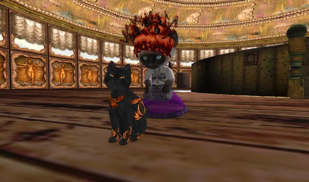 A Second Life Resident wearing a Siamese kitty avatar pets a virtual cat named Ember