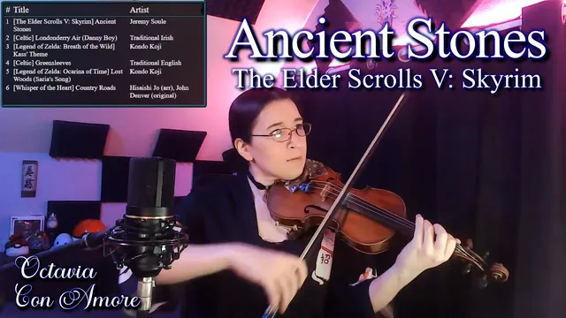 A single-frame capture of a video of a violinist in bi-lighting with the title "Ancient Stones, The Ender Scrolls V: Skyrim"
