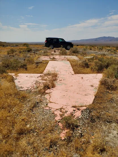 Drove my black Toyota 4Runner up to one of the remaining concrete arrows from the Transcontinental Airmail Service. These giant arrows (this one currently painting orange) would point pilots in the 1920-1930s to the next arrow, creating a visual route across the county. This arrow also has two large concrete pads connected to it, one to house the beacon for navigation at night, and the other to hold the building with the generator for the beacon's light.