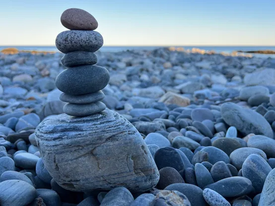 Stacked rocks on a rocky beach in York, Maine.