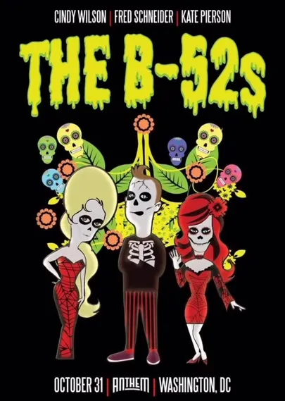 Candy skulls in purple, yellow and pink serve as a background to the lead singers of the B-52s. Portrayed as cartoon characters with skull faces but their signature bouffants rising high to the sky.