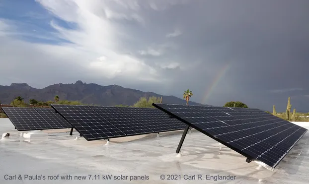 Solar panels on roof with rainbow. 
© Carl R. Englander