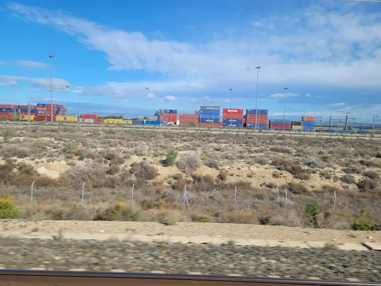 Freight container depot west of Zaragoza. Up to 4 containers stacked up.