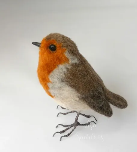 Side view of a needle felted european robin