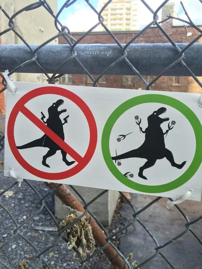 Red circle with a line through it has a dinosaur grumpily waving guns.

Green circle with no line through it has a dinosaur cheerfully tossing flowers around.

Both circles are on a sign, hanging on a chainlink fence.