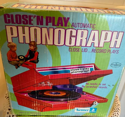 A late 1970s box for a close ‘n play record player for kids. Very groovy art style.