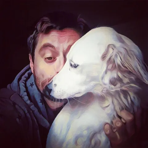 A man and his beloved white dog