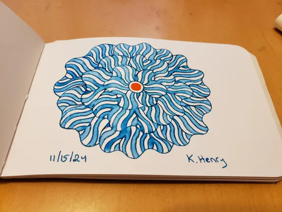 Hand drawn generative/procedural art in ink on an open page of my sketchbook. The abstract pattern is floral.