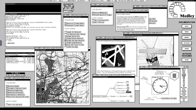 Screenshot of the black and white desktop of a 1980s graphical workstation environment. The desktop has a gray background pattern and several windows with a white background and a title bar with white text on a black background. The windows display text, bitmaps, graphs, icons, sketches, and other graphical documents and elements.