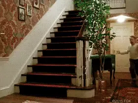 An animated GIF showing Macaulay Culkin running excitedly around his empty house - from the movie Home Alone