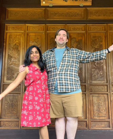 Our photo in front of a intricately carved Ming era door at the Lan Su Chinese Garden in Portland, Oregon. This is our CLASSIC pose. 