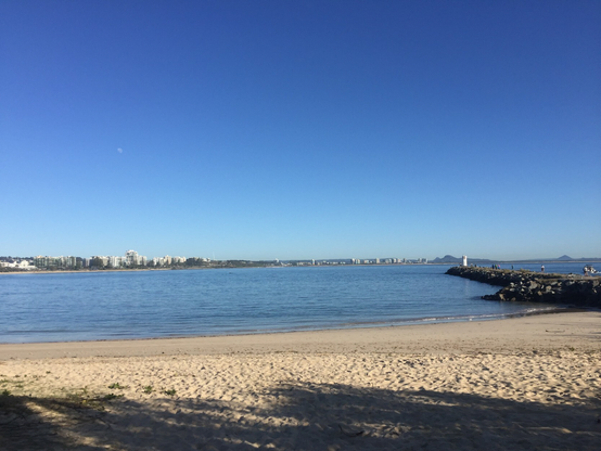 Looking at Cotton Tree from Mooloolaba Beach, near the Mooloola River mouth, on a sunny morning. 