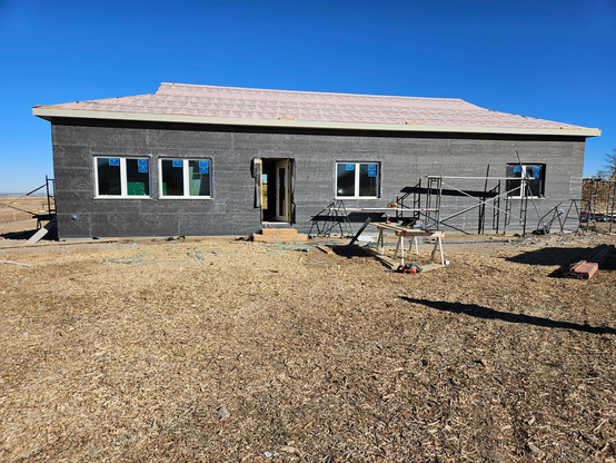 The rebuilt house on the construction site on Dec 28, 2023, showing the exterior prepped for the application of stucco siding in the new year. 2 days less than 2 years after the fire.