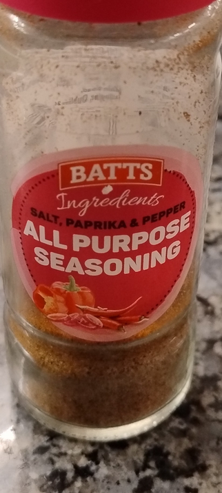 Close-ip of a Batts All Purpose Seasoning container. 
