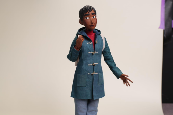 A puppet wearing a blue dafflecoat. This puppet is from a stopmotion short movie and is about 30cm tall.