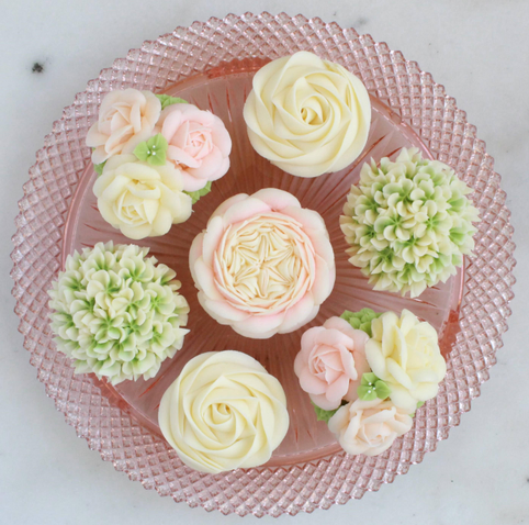 Buttercream flower cupcakes: pink and white roses, soft pink English rose, and green and white hydrangeas