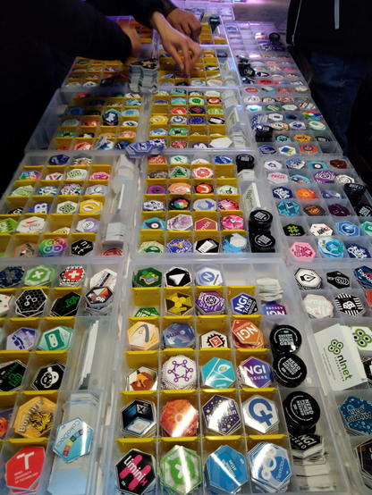 Table with boxes and boxes of hex stickers all together 300 unique designs.