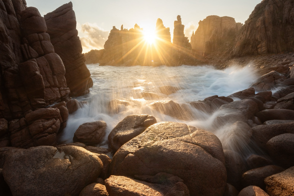 Rocky, powerful waves, golden light, granite rocks, direct sunlight