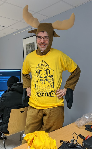 Gerry in a moose suit and a FOSDEM staff shirt