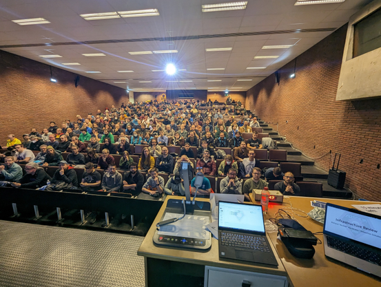 Full room, almost all seats taken.