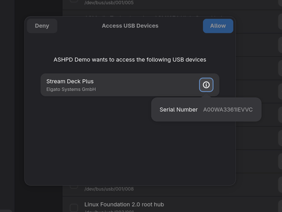 Dialog with a header bar and page with a description and list of USB devices. The header bar has the Deny button on the left side, “Access USB Devices” in the title, and Allow on the right side. The description reads “ASHPD Demo wants to access the following USB devices”. The list shows a row with “Elgato” as the title and “Stream Deck Plus” as the description, along with its serial number in a popover.