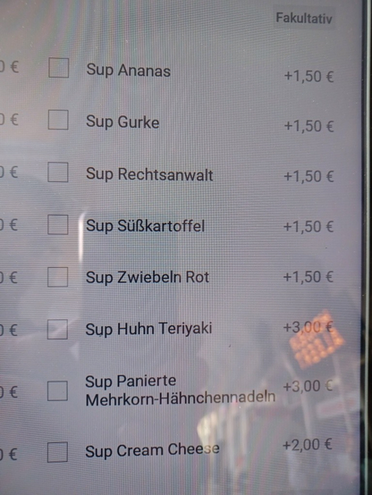 Photo of (badly translated) German menu in a French restaurant, reading:
Fakultativ
Sup Ananas
Sup Gurke
Sup Rechtsanwalt
Sup Süßkartoffel
Sup Zwiebeln Rot
Sup Huhn Teriyaki
Sup Panierte Mehrkorn-Hähnchennadeln
Sup Cream Cheese