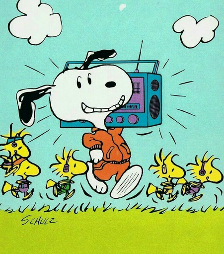 Snoopy holding a ghetto blaster. 