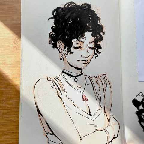 Portrait study of a woman with big black curls and several necklaces in ink 