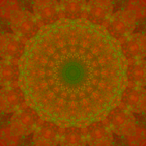 Colorful mandala with fiery red tones and some green in it.
