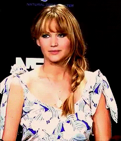 Jennifer Lawrence sarcastically nodding and saying, "Okay," followed by a thumbs-up.
