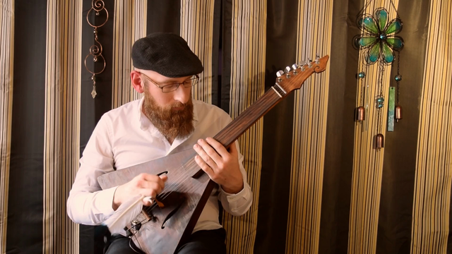 Fretless lute being played for demo