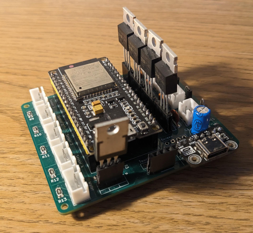 Photo of a PCB with a microcontroller and various components