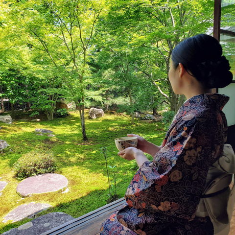 Nao-san enjoys a matcha and soaks in the early morning warmth, bathed in the greens of late spring.