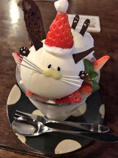 Cat themed parfait for Christmas, with a strawberry doubling as Santa's hat.