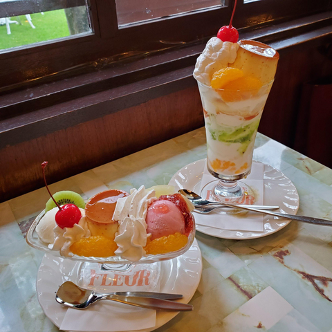 Parfait in a traditional kissaten (coffee shop). The huge portions contain oranges, limes and whole purins (caramel puddings).