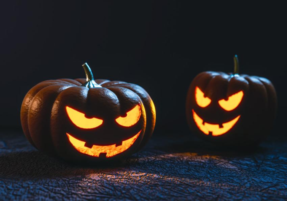 Spooky Halloween carved pumpkins in the dark