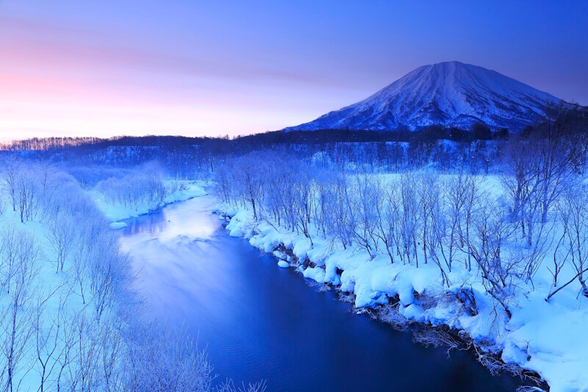 Yōtei in Hokkaido seen from a distance with a river in the foreground