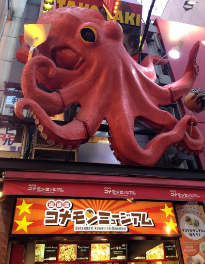 A giant octopus sits atop a takoyaki shop in Dotonburi.