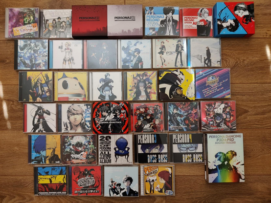 my collection of Persona soundtrack CDs laid out on the floor, there are a lot of them