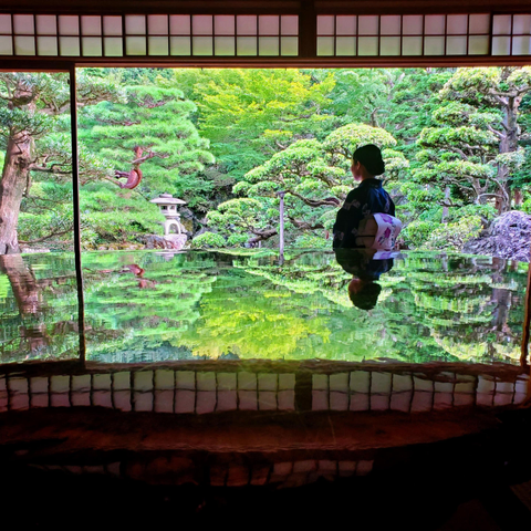 Nao-san reflected in the quince table at Kyutei Omuro.