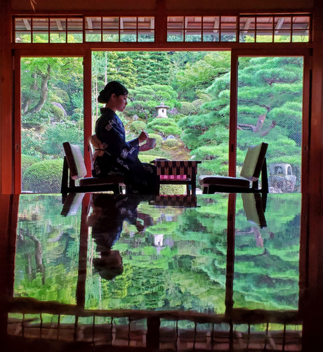 Nao-san enjoys tea at Kyutei Omuro...her reflection caught in the polished table.